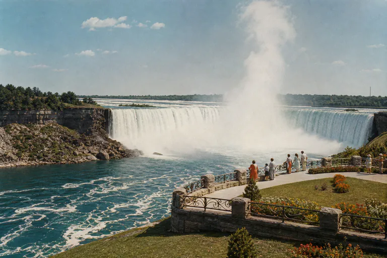 Niagara Falls viewed from a public scenic lookout in a 1950s-inspired travel photograph.